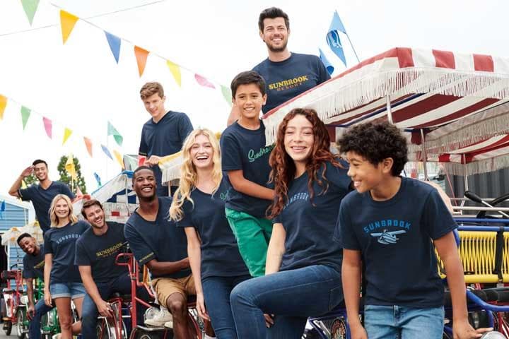 Group wearing custom printed t-shirts at outdoor event or team gathering